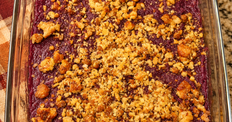 Homemade purple sweet potato casserole with a golden walnut praline topping, a family Thanksgiving favorite known as the Purple People Eater.